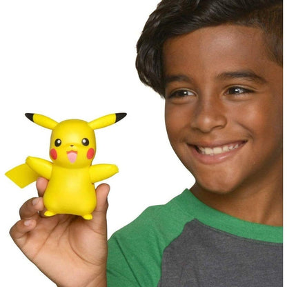 child holding pikachu toy