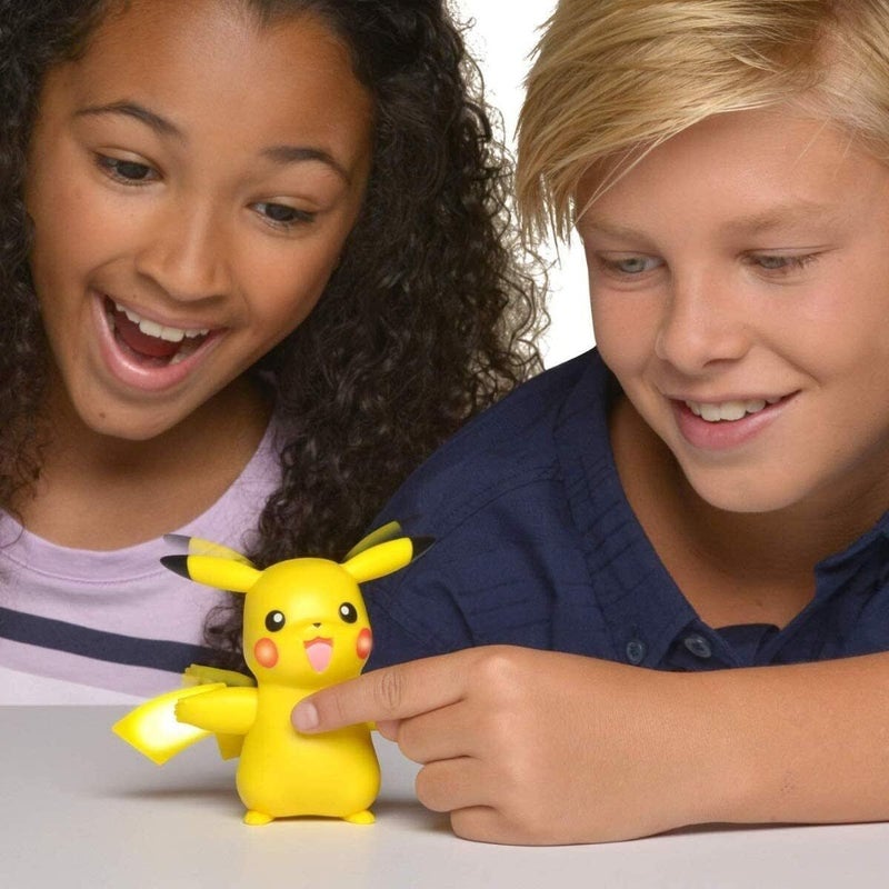 kids playing with pikachu toy