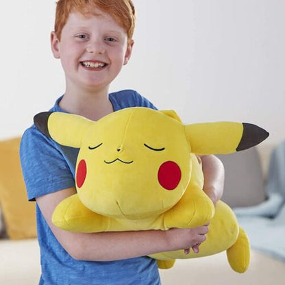 Child cuddling plush pikachu