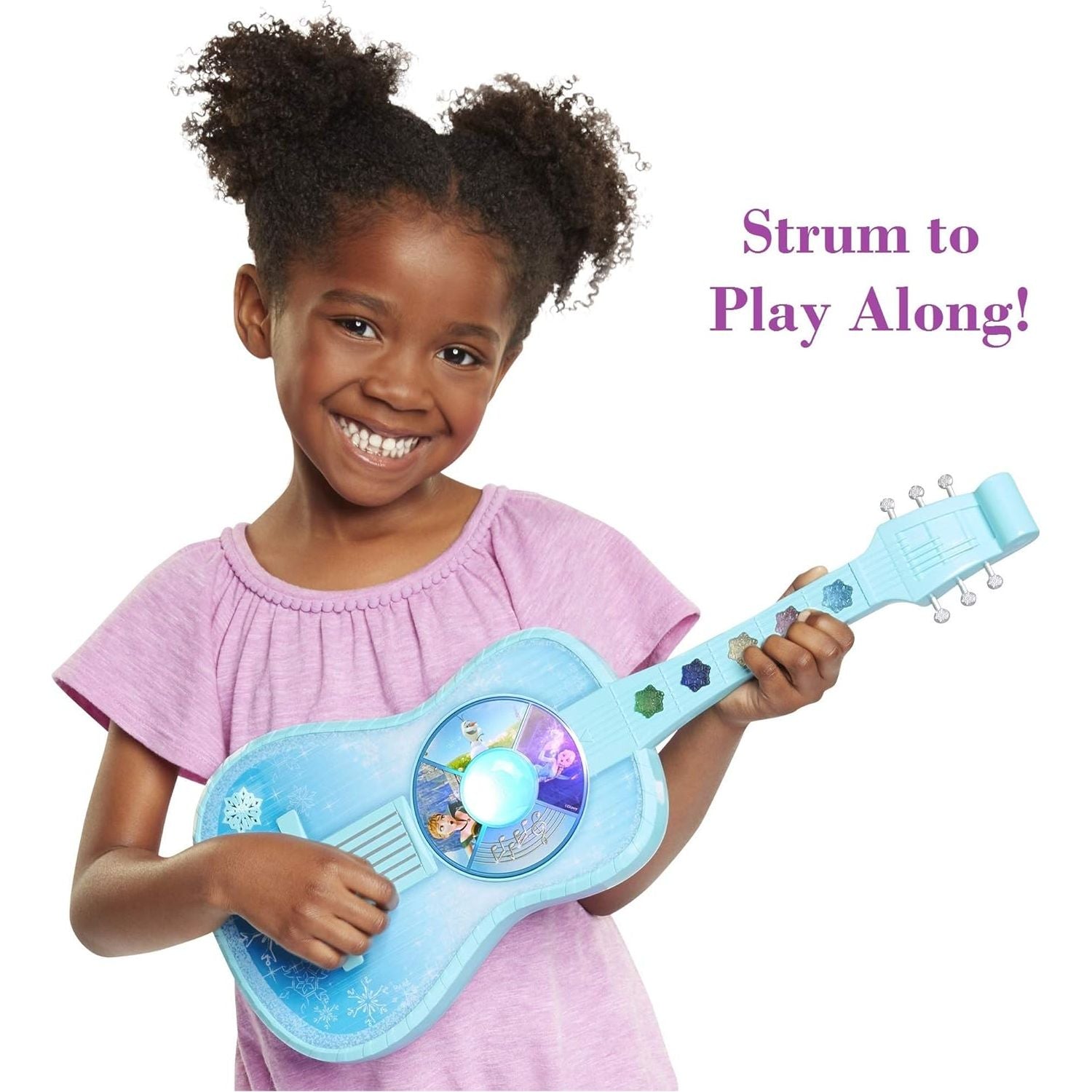 Child playing with frozen guitar toy